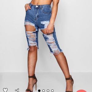 Ripped distressed denim board shorts